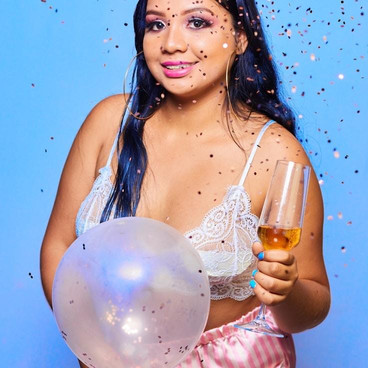 Name Placeholder, Lead Design Curator at Pocket Marsh Canvas, reviewing corporate floral arrangements